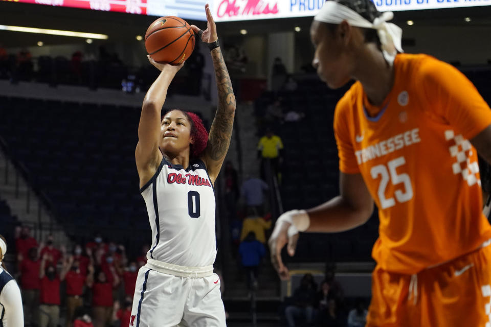 Mississippi forward Shakira Austin (0) attempts a basket while Tennessee guard Jordan Horston (25) watches during the second half of an NCAA college basketball game in Oxford, Miss., Sunday, Jan. 9, 2022. Tennessee won 70-58. (AP Photo/Rogelio V. Solis)