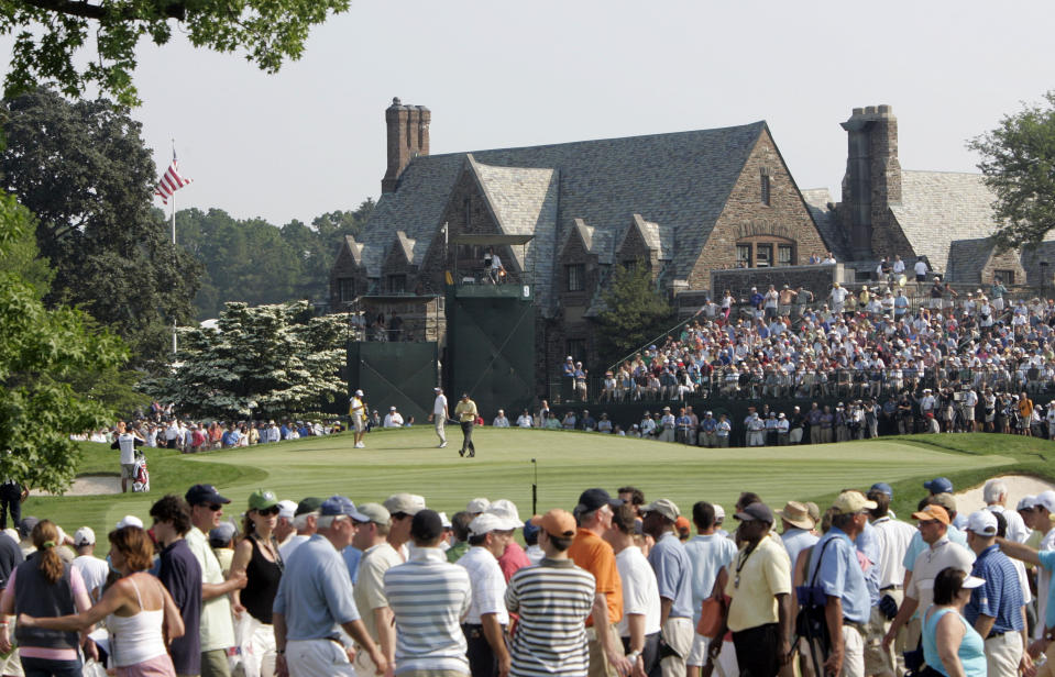 FILE - In this June 18, 2006, file photo, Phil Mickelson and Kenneth Ferrie are shown on the ninth green during the final round of the U.S. Open golf tournament at Winged Foot Golf Club in Mamaroneck, N.Y. The U.S. Open returns to Winged Foot next week, held in September because for the first time since 1913. (AP Photo/Morry Gash, File)