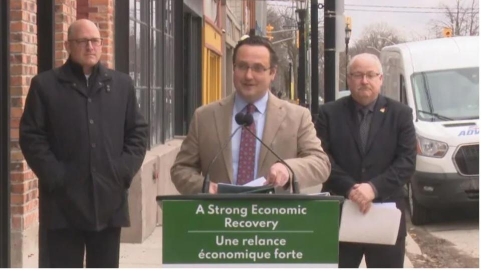 On April 1, MP Irek Kusmiercyzk announces a $2.5 million compensation package for businesses impacted by the bridge blockade. He is flanked by Mayor Drew Dilkens and Invest Windsor Essex CEO Stephen MacKenzie.