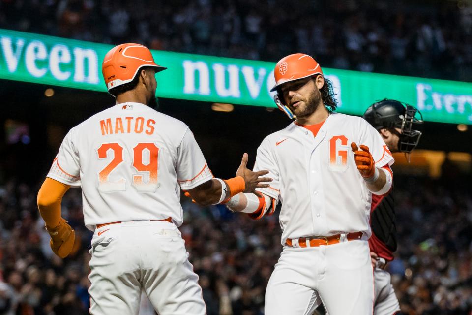 Aug 1, 2023; San Francisco, California, USA; San Francisco Giants shortstop Brandon Crawford (35) is congratulated by center fielder Luis Matos (29) after he hit a two-run home run against the Arizona Diamondbacks during the sixth inning at Oracle Park. Mandatory Credit: John Hefti-USA TODAY Sports