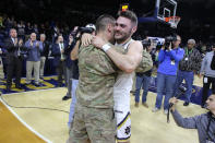 <p>Notre Dame Fighting Irish guard Matt Farrell (5) gets a surprise for the holiday from his brother who was deployed in Afghanistan ( Army Lt. Bo Farrell) during an NCAA basketball game between the Colgate Raiders and the Notre Dame Fighting Irish on December 19, 2016, at Purcell Pavilion in South Bend, IN. Notre Dame defeated Colgate 77-62. (Photo by Marcus Snowden/Icon Sportswire via Getty Images) </p>