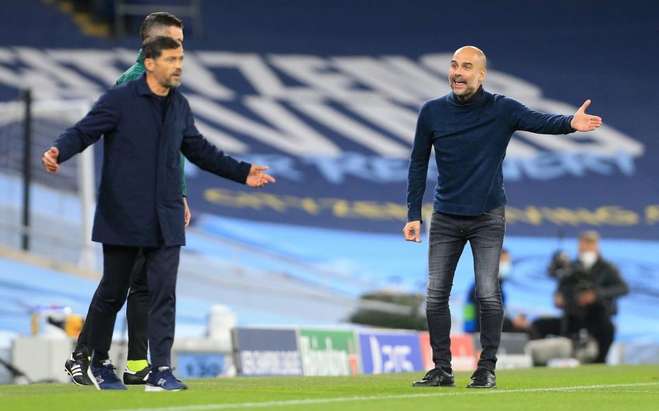 Man City manager Pep Guardiola argues with Porto coach Sergio Conceicao during the UEFA Champions League Group C match between Manchester City and FC Porto - GETTY