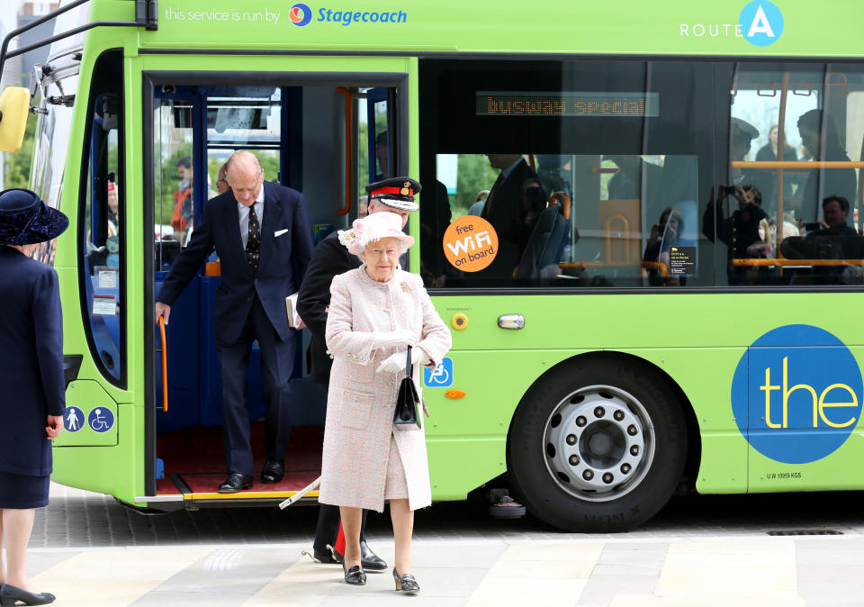 The Bentley has a flat tyre: Queen Elizabeth and the Duke Of Edinburgh arrive in style during a visit to Cambridge