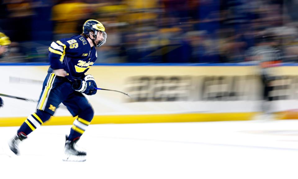 Seamus Casey of the Michigan Wolverines celebrates a goal in the first period during a semifinal of the 2023 Frozen Four against the Quinnipiac Bobcats at Amalie Arena in Tampa, Florida, on Thursday, April 6, 2023.