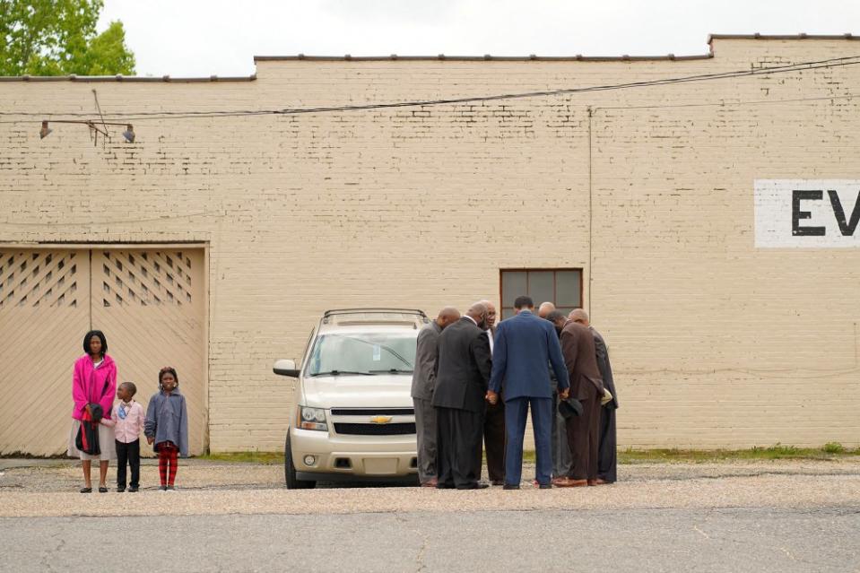 Pastors and community members pray ahead of a vigil the day after a shooting during a teenager's birthday party at Mahogany Masterpiece Dance Studio in Dadeville, Ala., on April 16.<span class="copyright">Cheney Orr—Reuters</span>