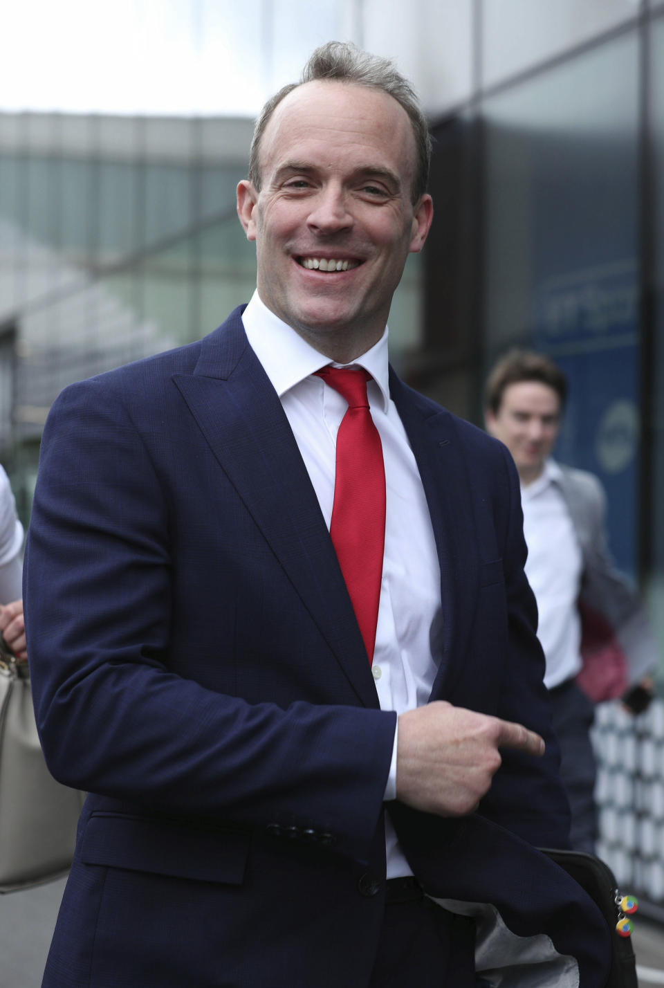 Conservative party leadership contender Dominic Raab arrives at the television studios ahead of a scheduled live television debate for the Conservative Party leadership candidates, in London, Sunday June 16, 2019. Five out of the six candidates will appear in the first TV debate, with Boris Johnson declining to take part, although other candidates accuse him of trying to avoid scrutiny. (Yui Mok/PA via AP)