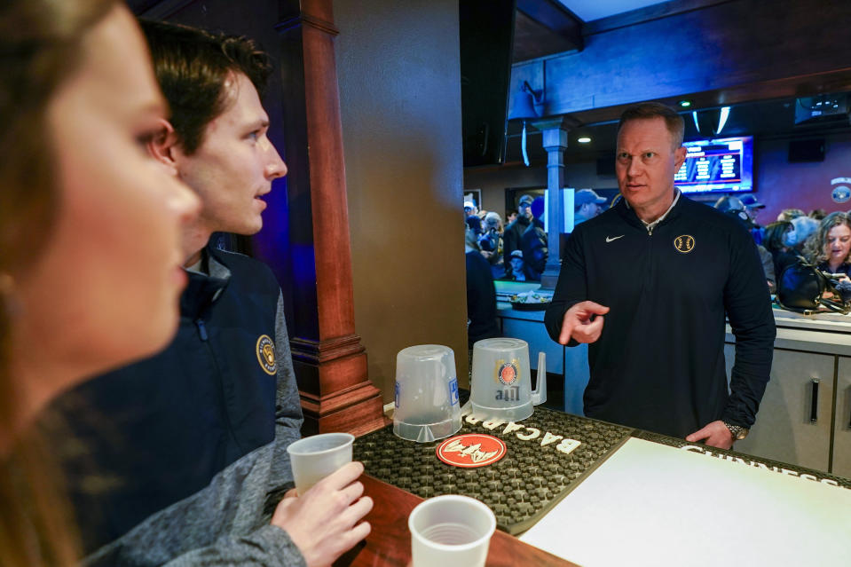 Milwaukee Brewers' General Manager Matt Arnold bartends at a promotional event Wednesday, Jan. 18, 2023, in Milwaukee. (AP Photo/Morry Gash)