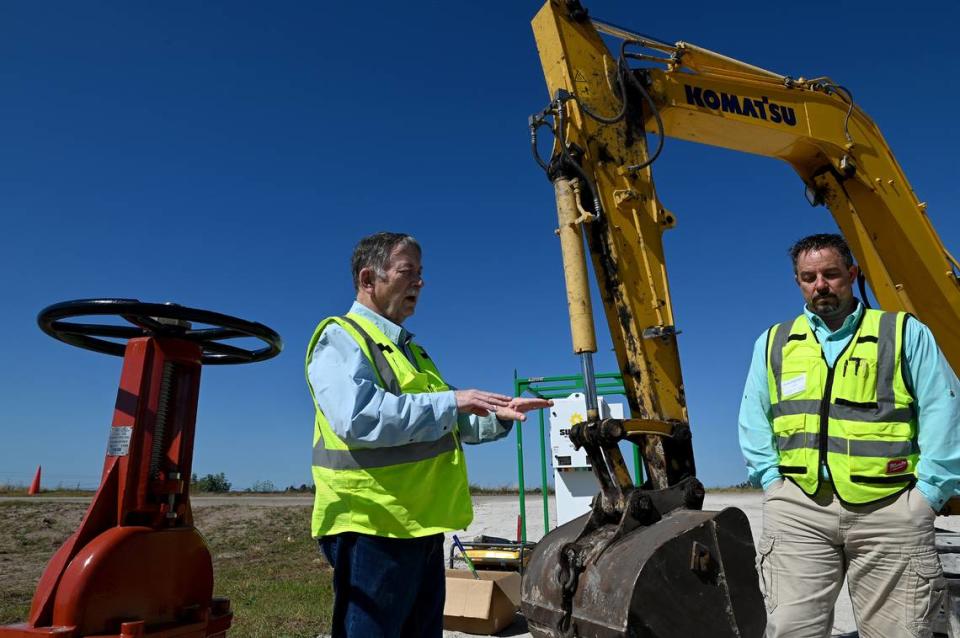 Court-appointed receiver Herb Donica and site manager Jeff Barath at a water-filtration site at Piney Point. Two years after an emergency water release became an environmental disaster for Tampa Bay, conditions have greatly improved at Piney Point, according to site operators. Site closure is underway and the largest pond will be drained soon.