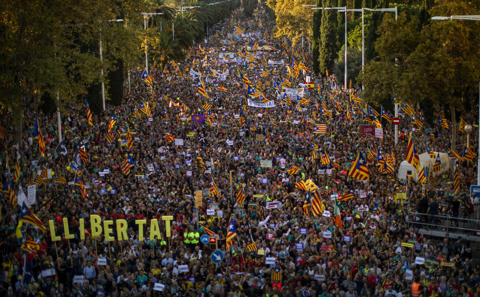 Catalan pro-independence protesters gather during a demonstration in Barcelona, Spain, Saturday, Oct. 26, 2019. Protests turned violent last week after Spain's Supreme Court convicted 12 separatist leaders of illegally promoting the wealthy Catalonia region's independence and sentenced nine of them to prison. (AP Photo/Emilio Morenatti)