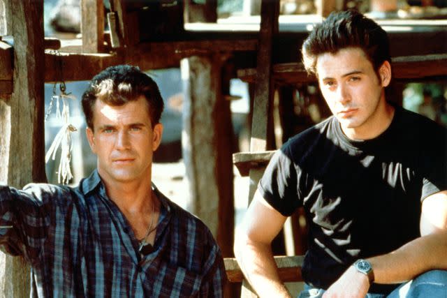 <p>Sunset Boulevard/Getty</p> Mel Gibson and Robert Downey Jr. in 'Air America'