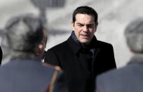 Greek Prime Minister Alexis Tsipras takes part in a wreath laying ceremony at the Tomb of the Unknown Soldier by the Kremlin walls in central Moscow, April 8, 2015. REUTERS/Ivan Sekretarev