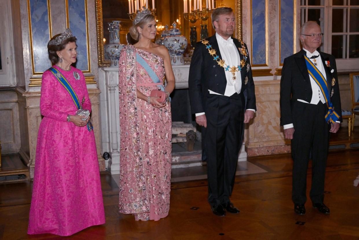 Queen Silvia of Sweden, Queen Maxima of the Netherlands, King Willem-Alexander of the Netherlands and King Carl Gustaf of Sweden stand for a picture before a gala dinner at the Royal Palace in Stockholm, Sweden, on October 11, 2022. - The royal couple of the Netherlands is on a three day long state visit to Sweden. - Sweden OUT (Photo by Fredrik SANDBERG / TT News Agency / AFP) / Sweden OUT (Photo by FREDRIK SANDBERG/TT News Agency/AFP via Getty Images)