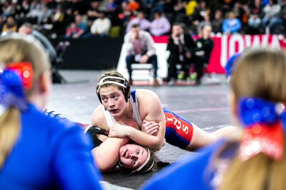 Decorah's Naomi Simon, top, wrestles Mount Vernon's Libby Dix at 170 pounds in the finals during the IGHSAU state girls wrestling tournament, Friday, Feb. 3, 2023, at the Xtream Arena in Coralville, Iowa.