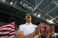 2016 Rio Olympics - Taekwondo - Preliminary - Men's -80kg Preliminary Round - Carioca Arena 3 - Rio de Janeiro, Brazil - 19/08/2016. Mark Lopez cheers on his brother Steven Lopez (USA) of USA (not pictured). REUTERS/Issei Kato