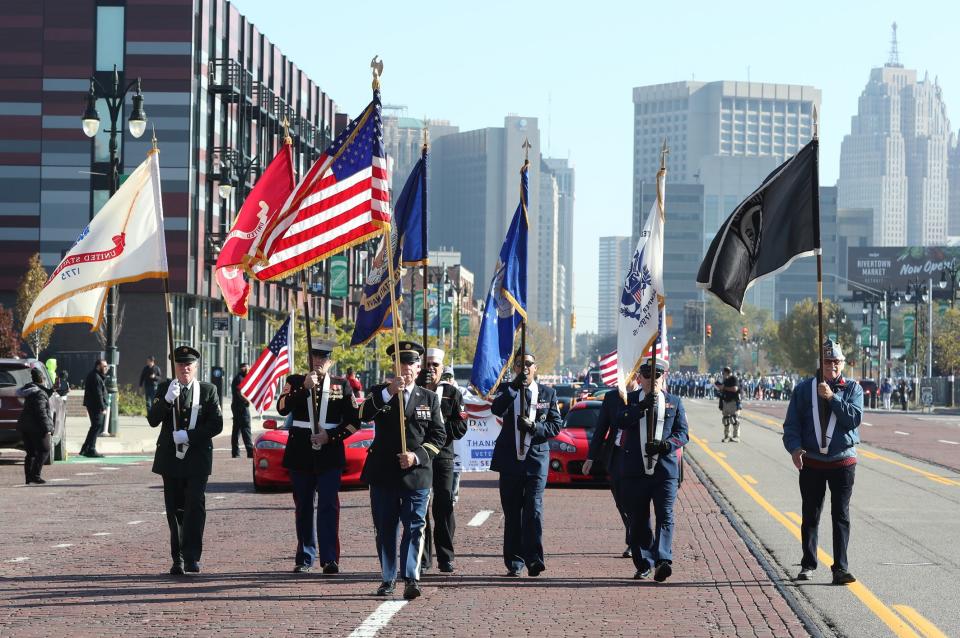 Participants march in the Veterans Day parade from Corktown down Michigan Ave. on Sunday, Nov. 7, 2021.