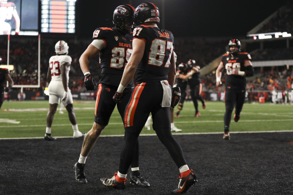 Oregon State tight end Riley Sharp (87) celebrates after scoring a touchdown against Stanford with tight end Bryce Caufield (89) during the second half of an NCAA college football game Saturday, Nov. 11, 2023, in Corvallis, Ore. (AP Photo/Amanda Loman)