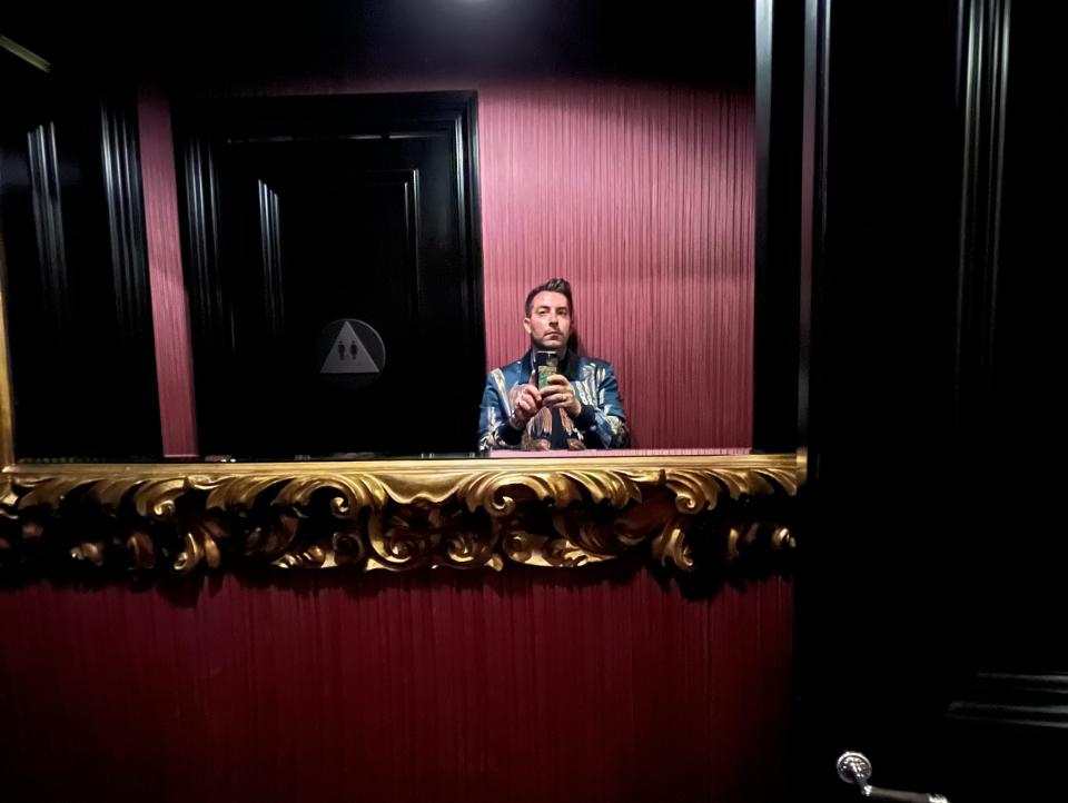 A man taking a selfie in a mirror.