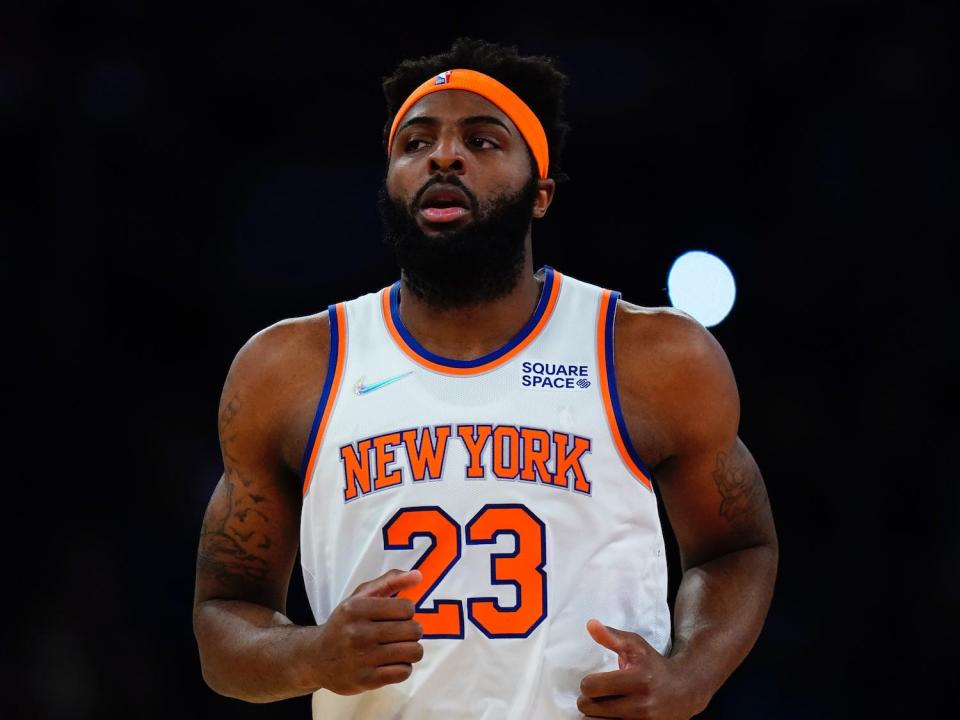 Mitchell Robinson runs up the court during a game.