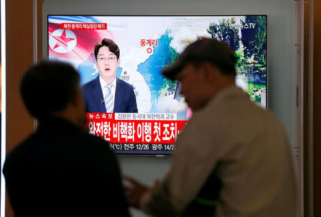 People watch a TV broadcasting a news report on the dismantling of the Punggye-ri nuclear testing site, in Seoul, South Korea, May 24, 2018. REUTERS/Kim Hong-Ji