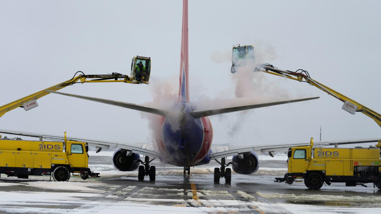A Southwest Airlines plane is de-iced before takeoff at Salt Lake City International Airport on Wednesday in Utah as temperatures plummeted well below zero during Winter Storm Olive (AP Photo/Rick Bowmer) (Copyright 2023 The Associated Press. All rights reserved)