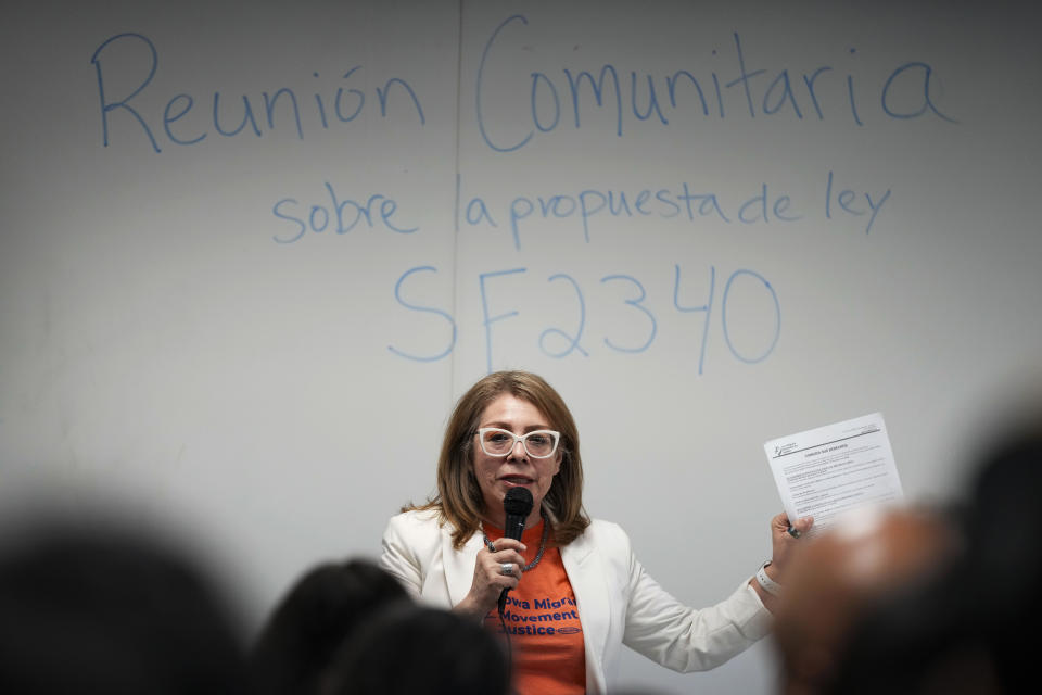 Community organizer Maria Acosta speaks during an Iowa Migrant Movement for Justice informational meeting, Wednesday, March 27, 2024, in Des Moines, Iowa. A bill in Iowa that would allow the state to arrest and deport some migrants is stoking anxiety among immigrant communities about how it would be interpreted and enforced. (AP Photo/Charlie Neibergall)