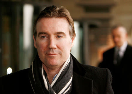 FILE PHOTO - The Chief Executive of Royal Mail, Adam Crozier, leaves after appearing before the Business and Enterprise Committee at Portcullis House, in London February 24, 2009. REUTERS/Luke MacGregor/File Photo