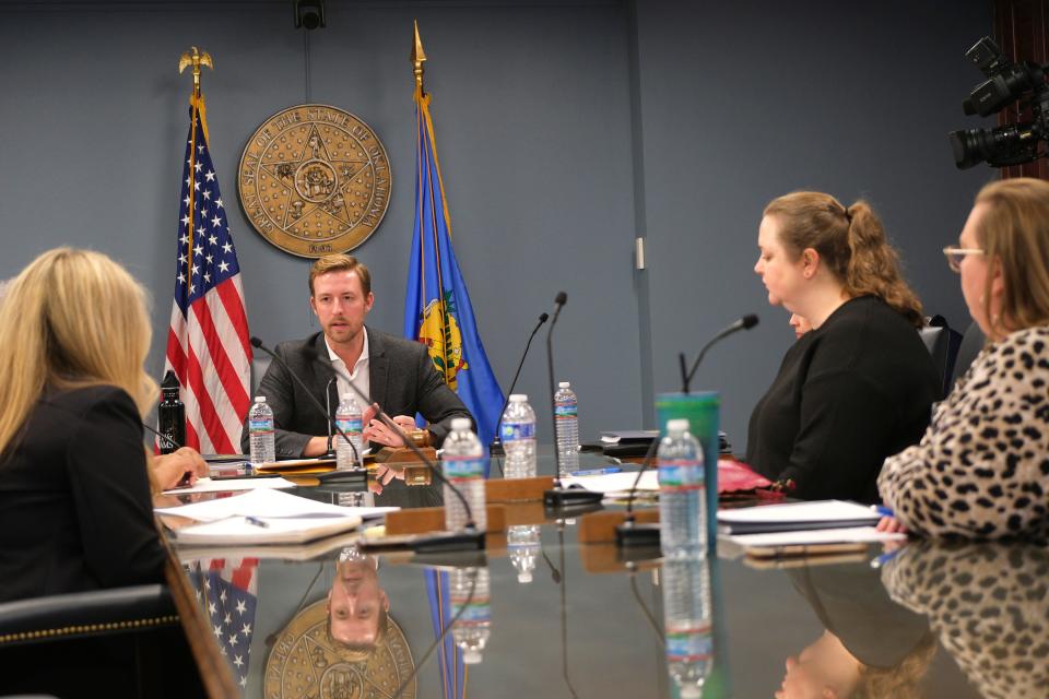 Oklahoma state schools Superintendent Ryan Walters addresses board members, from left, Kendra Wesson, Sarah Lepak and Katie Quebedeaux, during a special meeting of the state Board of Education to consider revoking the license of a teacher from the Western Heights district.