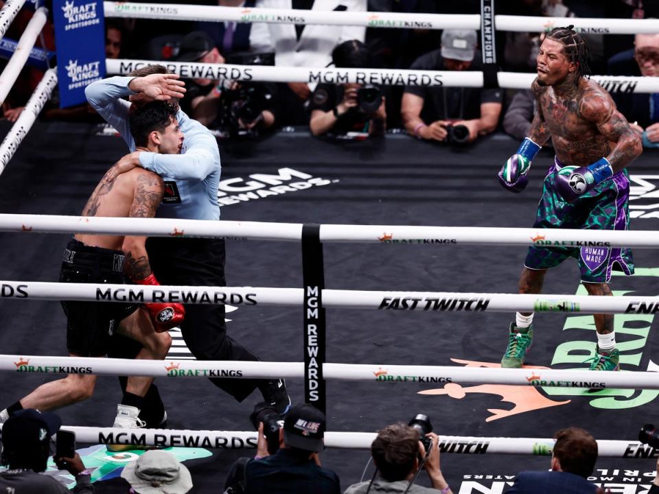 Garcia (left) was dropped twice by Gervonta Davis en route to his first loss (EPA)