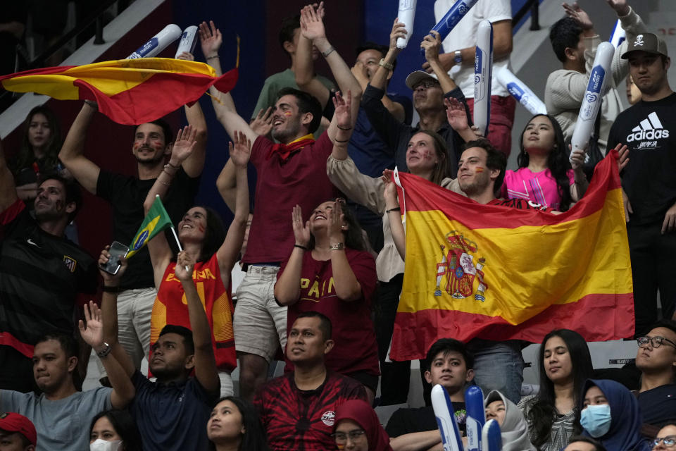 Supporters wave Spanish flags during the Basketball World Cup group G match between Spain and Brazil at the Indonesia Arena stadium in Jakarta, Indonesia, Monday, Aug. 28, 2023. (AP Photo/Achmad Ibrahim)