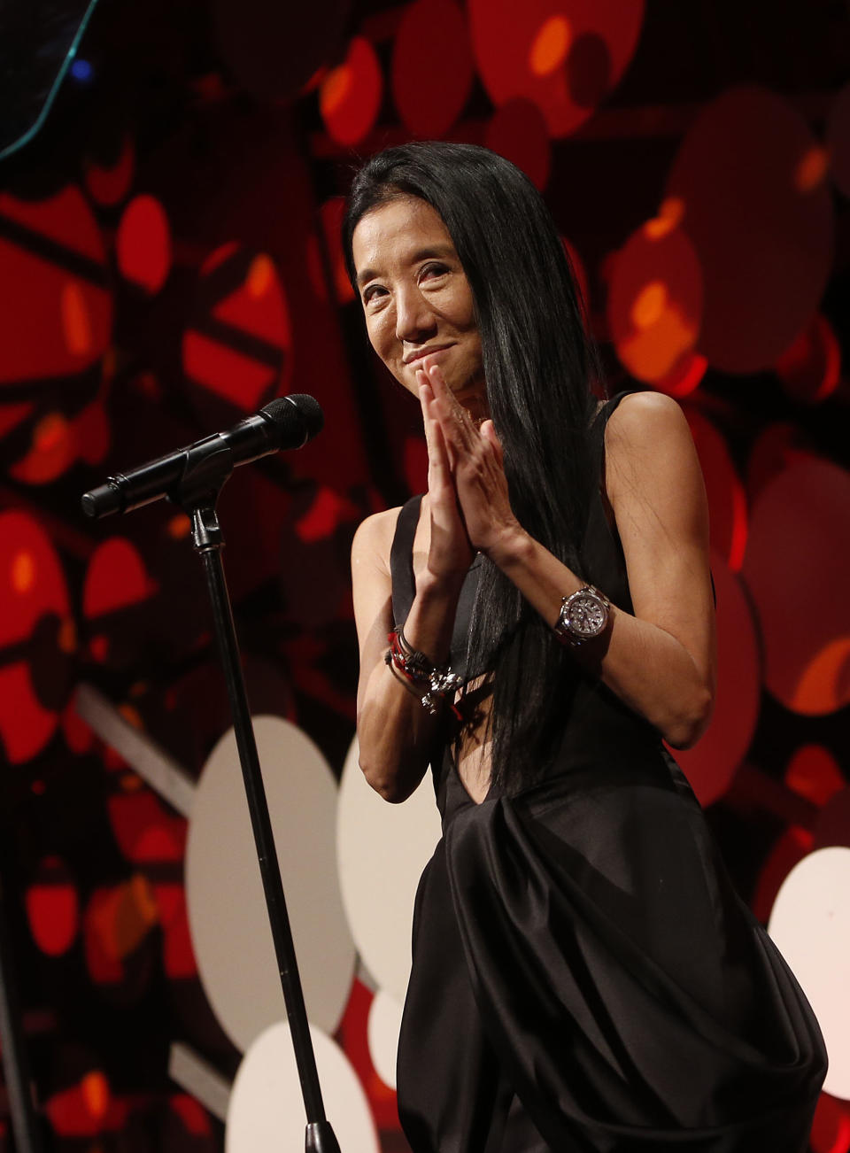 FILE - This May 1, 2013 file photo originally released by Coty shows fashion designer Vera Wang accepting an award at the seventh annual Delete Blood Cancer Gala in New York. Wang, 63, was honored for her lifetime achievement by the Council of Fashion Designers at its star-studded awards show Monday night. She received the award from her former employer and mentor Ralph Lauren, and she received a standing ovation from her peers. (AP Photo/Coty, Jason Decrow, file)