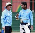 Sri Lanka's captain Kumar Sangakkar (R) speaks with coach Trevor Bayliss during a practice session ahead of their ICC Cricket World Cup match against Kenya, in Colombo February 28, 2011 in this file picture. REUTERS/Dinuka Liyanawatte