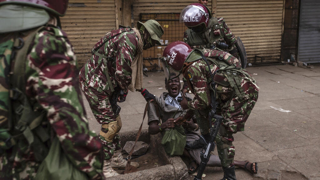 Kenyan police fire tear gas at protesters as new is sworn in