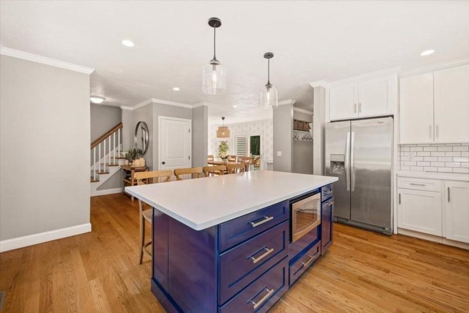 This single-family house at 27 Black Brook Road in Easton sold for $832,500 on Sept. 8, 2023. The heart of the home is a "stunning white cabinet kitchen with a four-person chef's table island adorned with Corian counters and a white tile backsplash," according to the real estate listing. This property was sold by Charles Lima at Keller Williams realty.