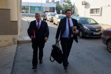Lawyer of the legal aid group Justice Abroad Michael Polak and one of the lawyers of a 19-year-old British woman Lewis Power Q.C, arrive at the Famagusta courthouse in Paralimni