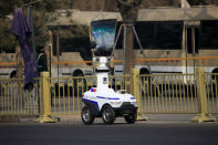 FILE PHOTO: A police robot patrols before the third plenary session of the Chinese People's Political Consultative Conference (CPPCC) in Beijing, China March 10, 2018. REUTERS/Aly Song/File Photo