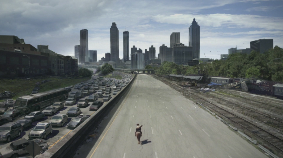 Rick riding down a highway into Atlanta