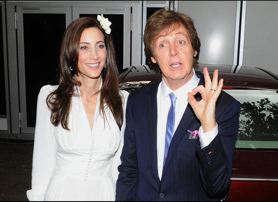 Sir Paul McCartney and his new wife Nancy Shevell arrive at their north London home following their wedding at Westminster Registry Office. (Photo credit: PA)