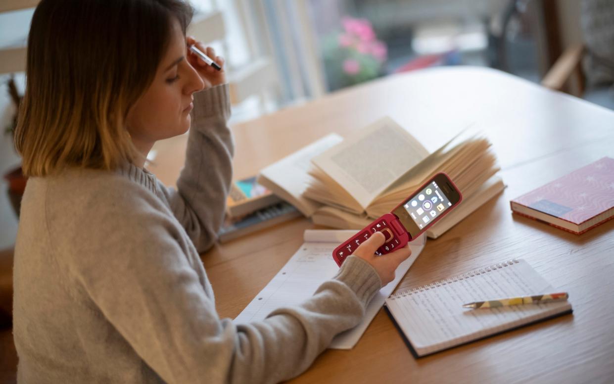 Abigail is forced to send texts on an old-school Nokia mobile