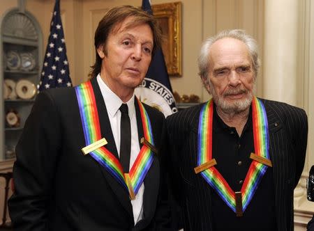 Kennedy Center Honoree for 2010 songwriter, musician and former Beatle Sir Paul McCartney (L) poses with fellow Honoree Country Western songwriter Merle Haggard in Washington, in this file photo taken December 4, 2010, in Washington. REUTERS/Mike Theiler/Files