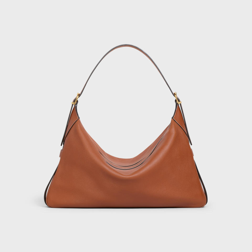 <p><a href="https://www.celine.com/en-us/celine-shop-women/bags/more-lines/large-romy-in-supple-calfskin-110793DPJ.04LU.html" rel="nofollow noopener" target="_blank" data-ylk="slk:Shop Now;elm:context_link;itc:0;sec:content-canvas" class="link ">Shop Now</a></p><p>Large Romy in Supple Calfskin Tan</p><p>$3450.00</p><p>celine.com</p>