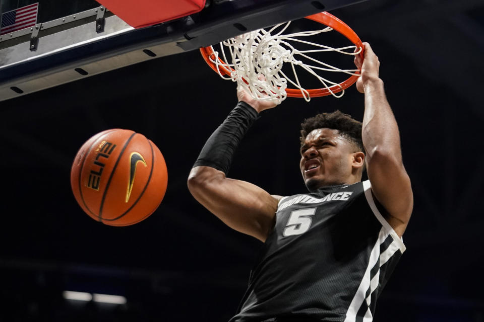 Providence forward Ed Croswell (5) dunks during the second half of an NCAA college basketball game against Xavier, Wednesday, Feb. 1, 2023, in Cincinnati. (AP Photo/Jeff Dean)