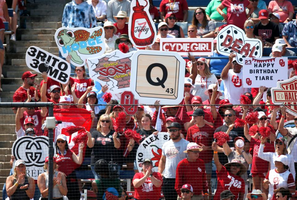 Oklahoma fans cheer during a softball game between the Oklahoma Sooners and Stanford in the Women's College World Series at USA Softball Hall of Fame Stadium in  in Oklahoma City, Monday, June, 5, 2023. 