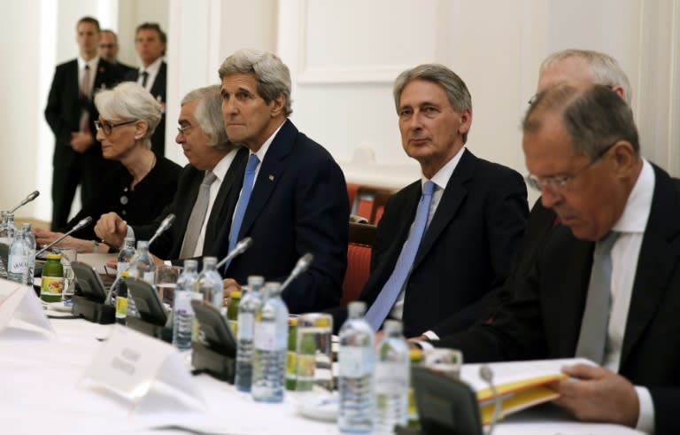 US Secretary of State John Kerry (3-L), British Foreign Secretary Philip Hammond (C) and Russian Foreign Minister Sergey Lavrov (R) sit around the table at the Palais Coburg Hotel in Vienna on July 6, 2015