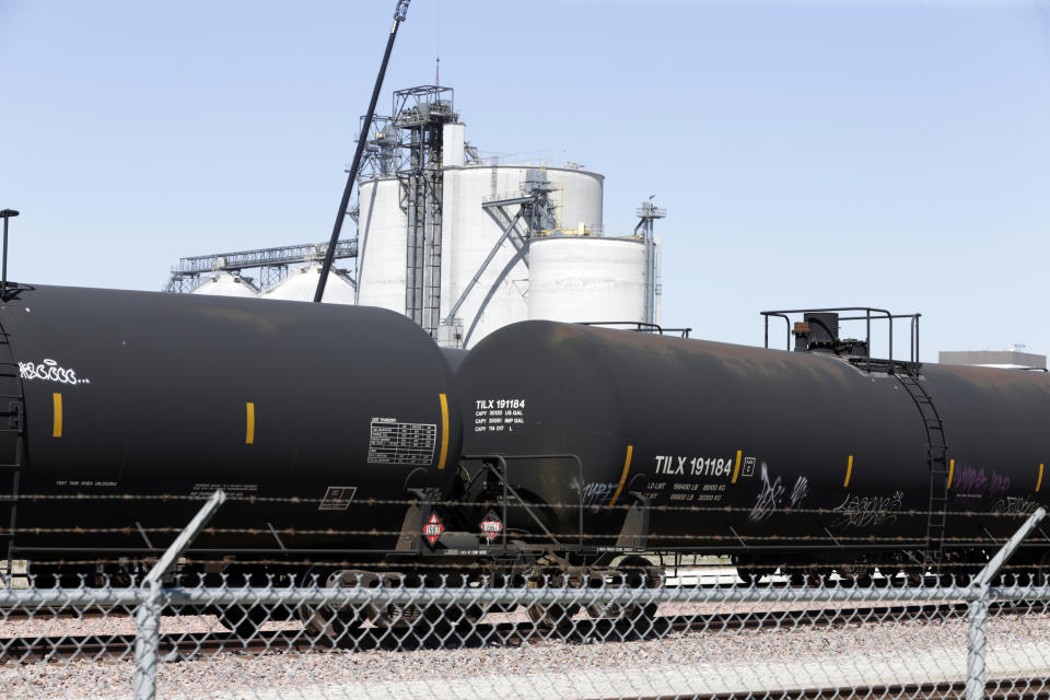 Ethanol train cars wait outside the Southwest Iowa Renewable Energy plant, an ethanol producer, in Council Bluffs, Iowa, Tuesday, April 21, 2020. The ethanol industry is under pressure after low oil prices and a coronavirus-related decline in travel cause demand for the fuel to plummet. (AP Photo/Nati Harnik)