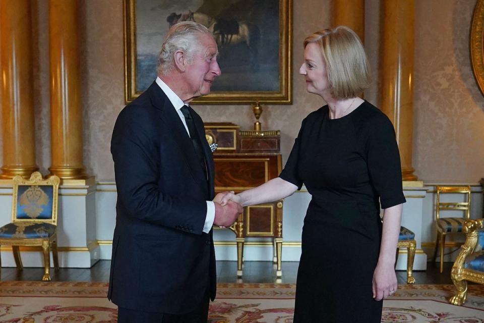 King Charles III greets the new prime minister Liz Truss at Buckingham Palace on Friday (Pool/AFP/Getty)