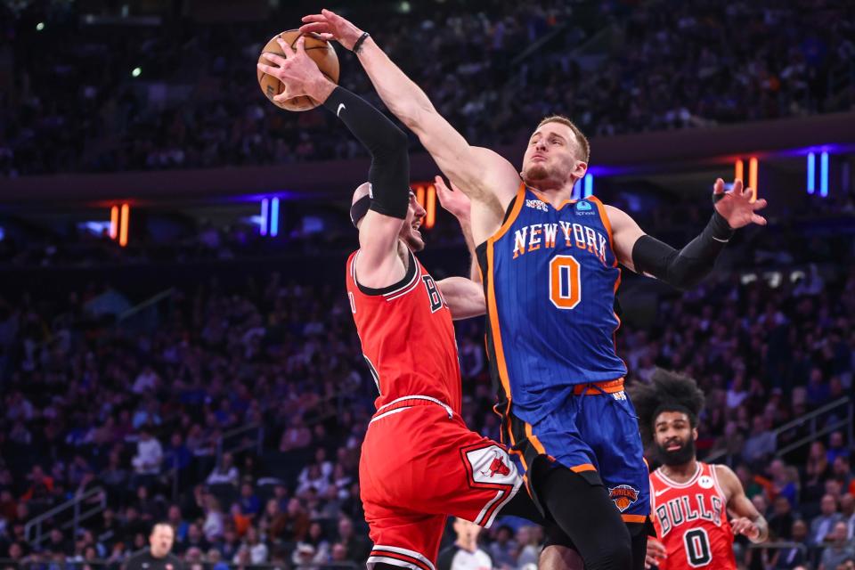April 14: New York Knicks guard Donte DiVincenzo (0) blocks a layup attempt taken by Chicago Bulls guard Alex Caruso (6) in the third quarter at Madison Square Garden.