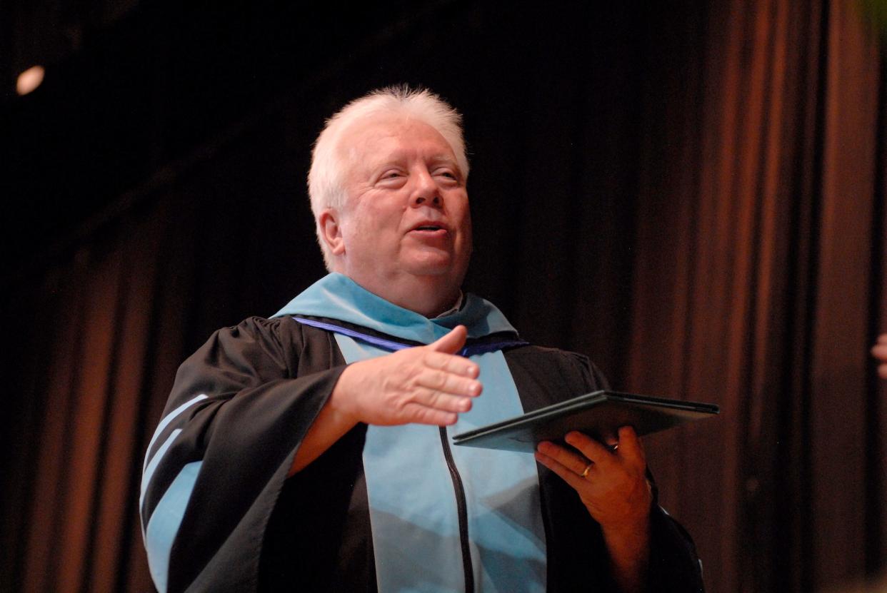 President of Trinity High School, Dr. Robert Mullen, hands out diplomas at the Trinity High School graduation Sunday, held at Bellarmine University. May 19, 2024