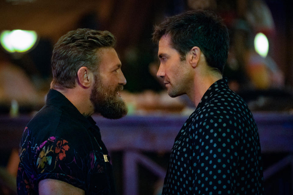 Photo of boxer Conor McGregor standing face to face with Jake Gyllenhaal in the movie Road House