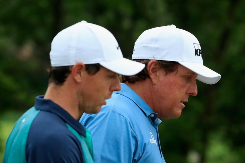 Rory McIlroy (left) hopes that Phil Mickelson is soon back playing on tour  (Getty Images)