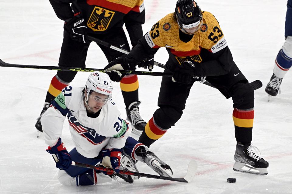 Team USA's Sean Farrell and Germany's Moritz Seider fight for the puck during the World Championships semifinal match in Tampere, Finland, on Saturday, May 27, 2023.